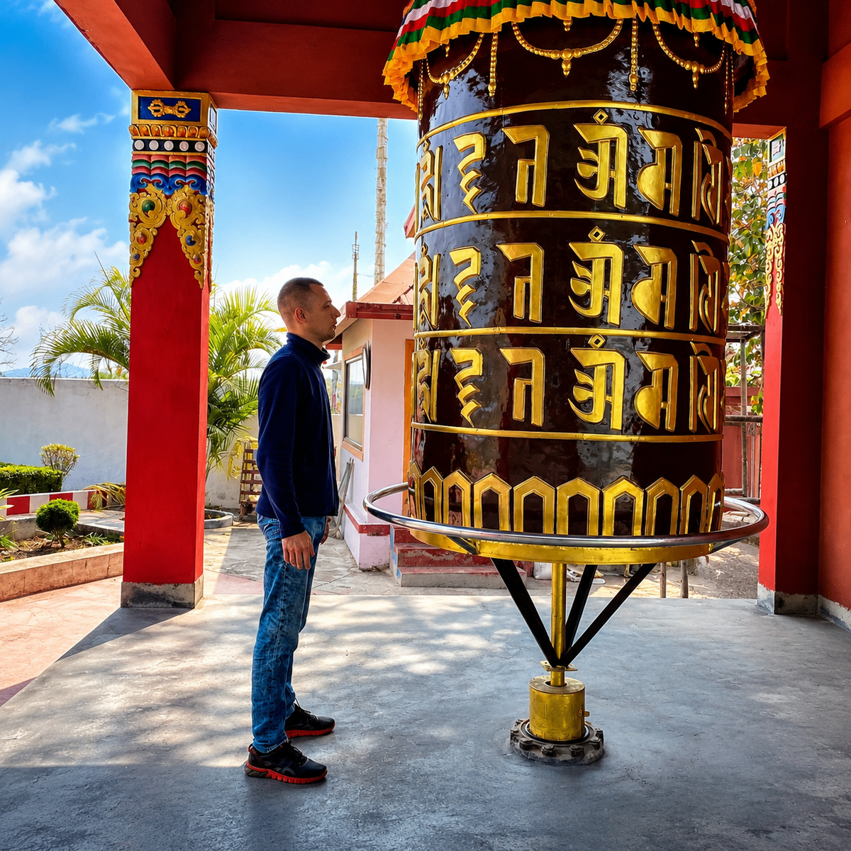 Large Tibetan prayer wheel turned during a private pilgrimage